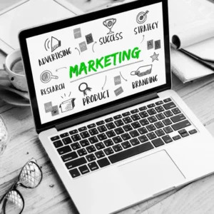 Digital marketing strategy concept with laptop showing marketing keywords like advertising, success, and branding